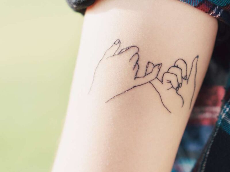 cute small tattoo deisgn on someone elbow