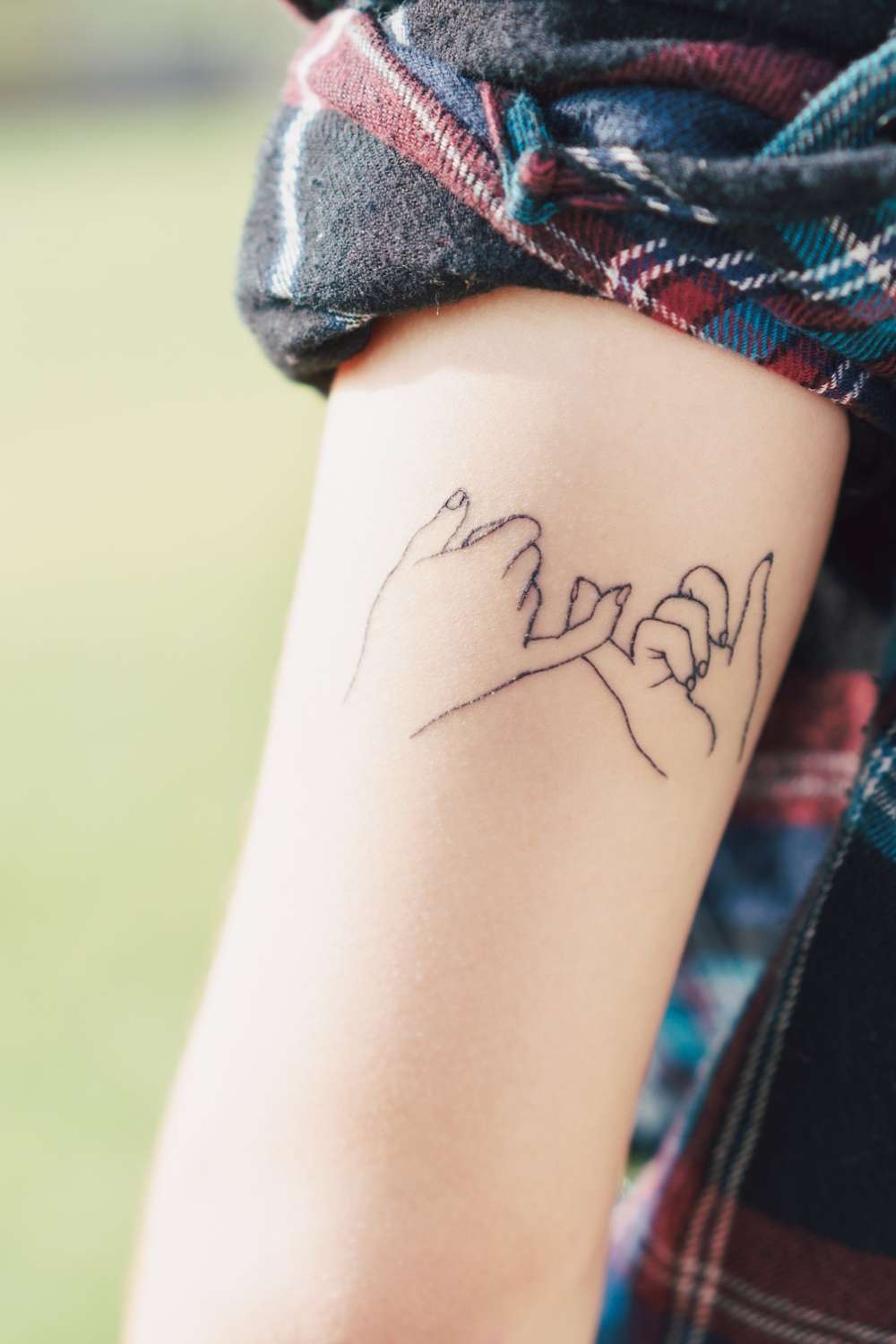 cute small tattoo deisgn on someone elbow