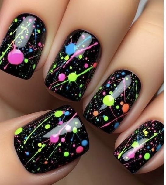 A hand with fun and quirky nails design.
