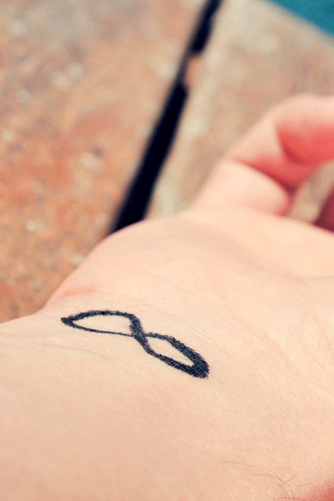 A tiny symbol tattoo that means infinity

