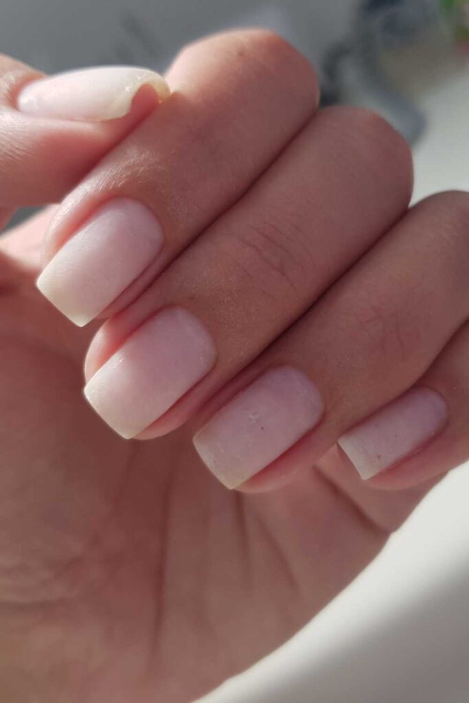 Hand showing off her short nails
