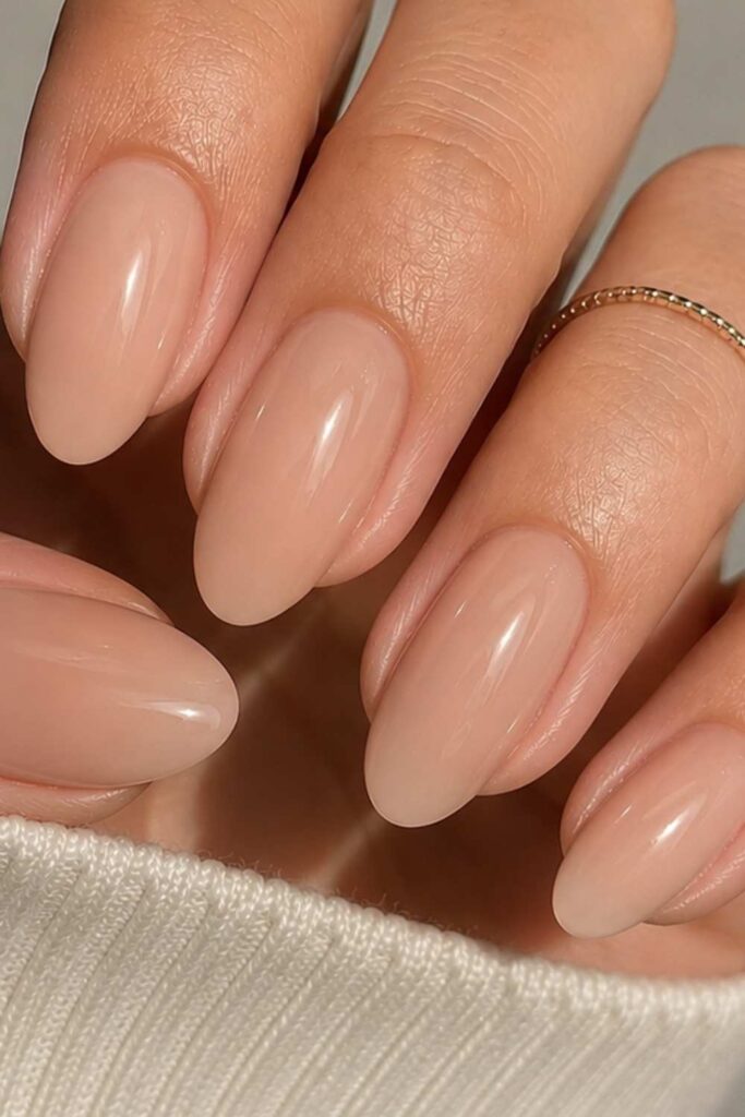 plain nude nails with subtle accent