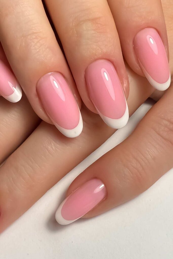 A popping baby pink nails with white tips