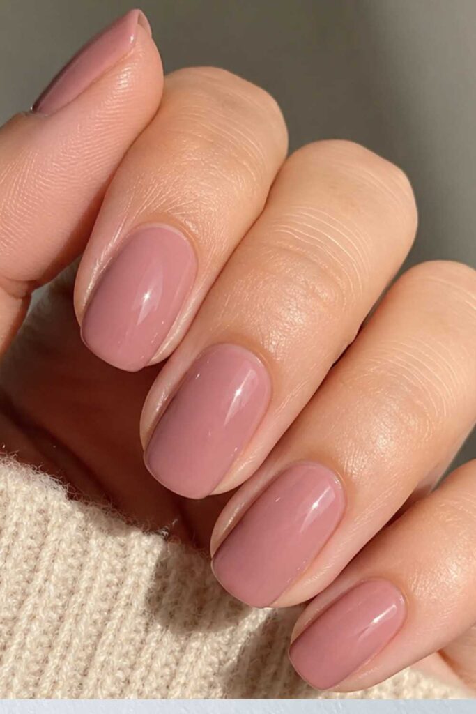 A dusty or muted nail design
