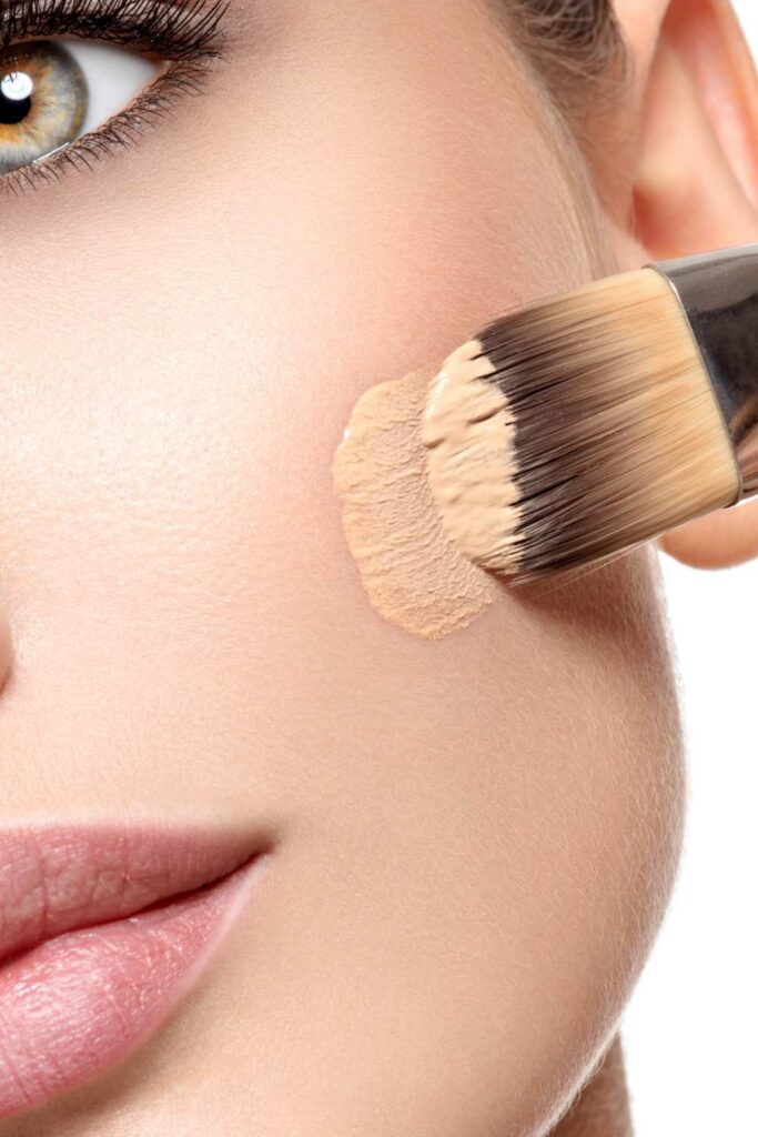 matching a foundation on a lady's face.