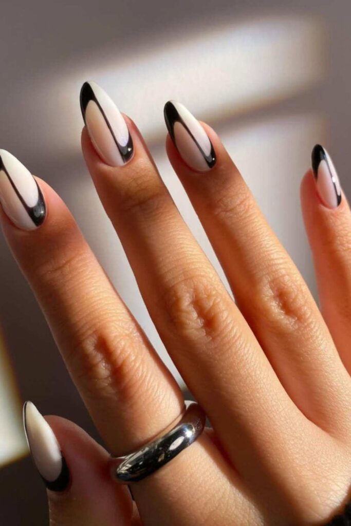 A picture of a nude nails design with a minimal  black line in the middle 