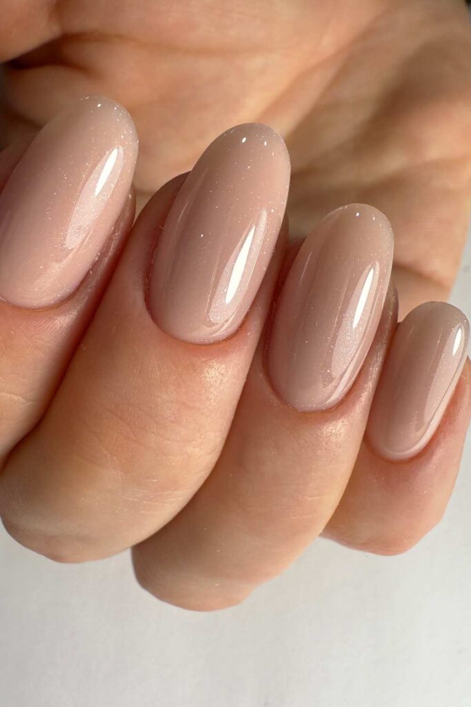 A picture of nude and neutral nail design.