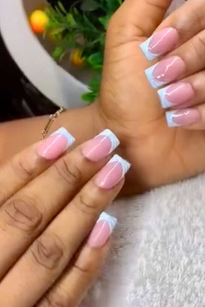 A picture of modern white French tips nails