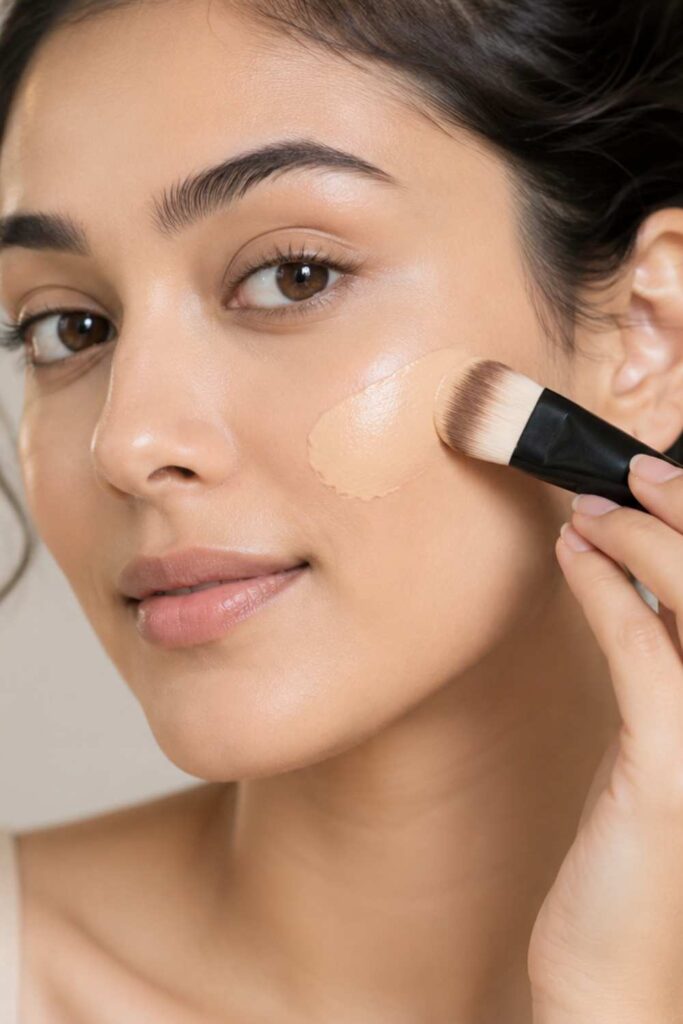 A white lady applying a light weighted foundation