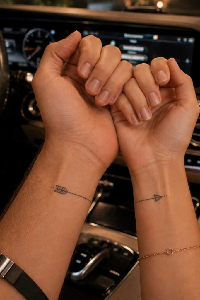 a picture of arrow couple tattoo that complete each other