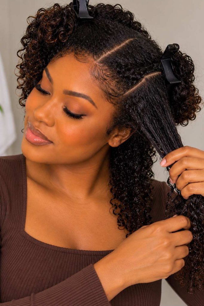 A picture of a lady dividing her hair into section