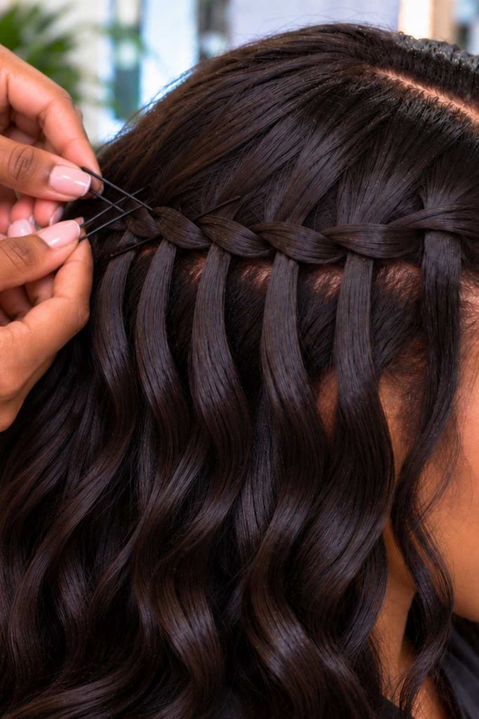 A picture of using bobby pins to secure the braids